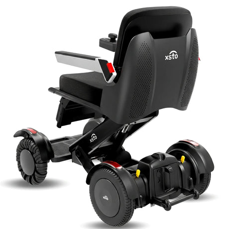 Vista trasera de la silla de ruedas motorizada con elevación de asiento para hablar cara a cara con otras personas dortomedical